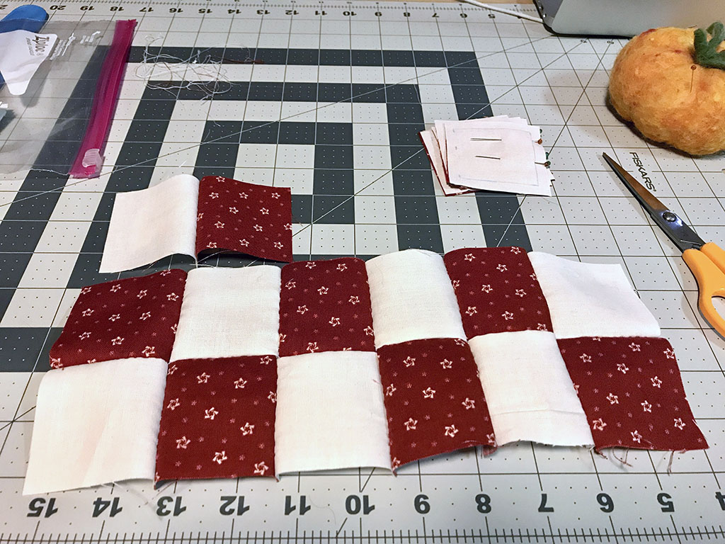 Several red and white 2-patch pieced together.