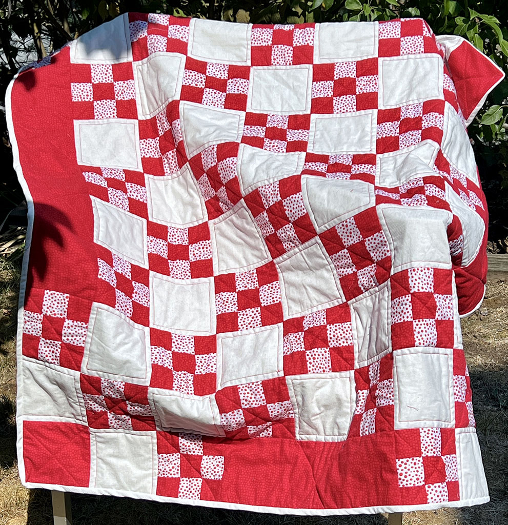 Red and white squares arranted in 9-patch and alternating solid squares.
