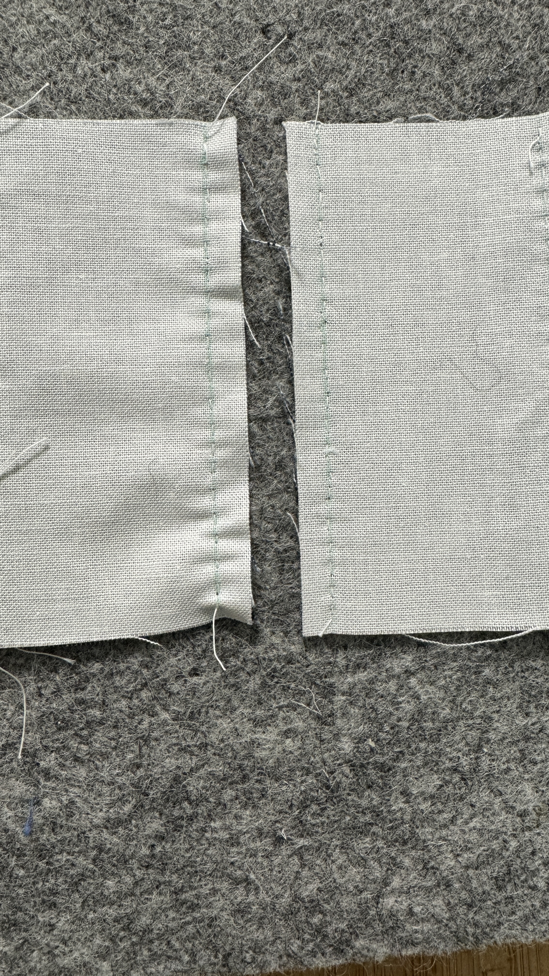 Two seams side by side. One is flat, the other one is wobbly.