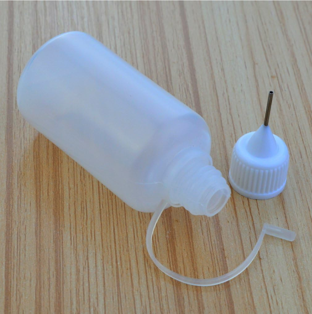 Small plastic applicator bottle on its side with the cap standing up, showing a needlenose applicator tip